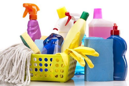 Cleaner preparing a home cleaning visit with service terms