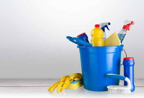 Staff member using PPE while cleaning in an Enfield property